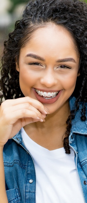 Young woman with traditional metal braces