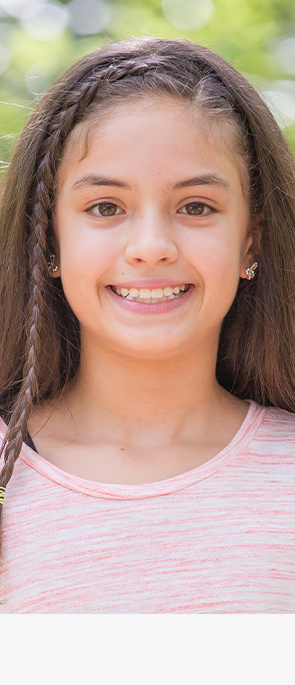 Young girl with InBrace braces smiling