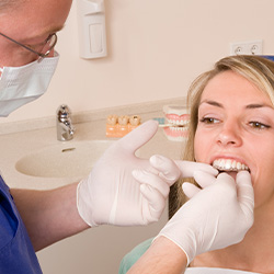 Woman being fitted with Invisalign by her dentist